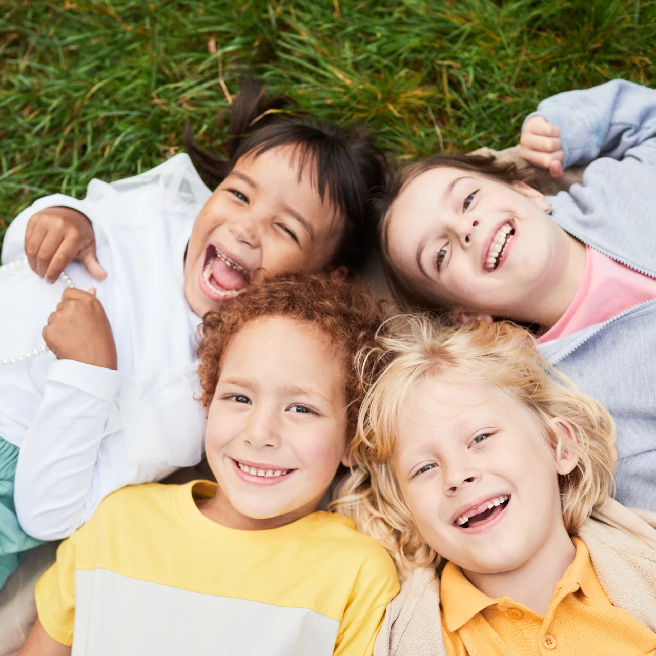four kids smiling | pediatric dentistry